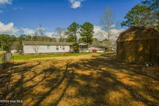 118 Woodland Drive, Swansboro, NC 28584 — 3-bedroom manufactured home in Hadnot Creek, Swansboro, NC, photo 13 of 16: Backyard
