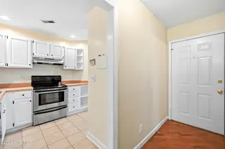 3039 Weatherby Court, Wilmington, NC 28405 — 2-bedroom home in Northchase, Wilmington, NC, photo 5 of 41: Hall and Kitchen