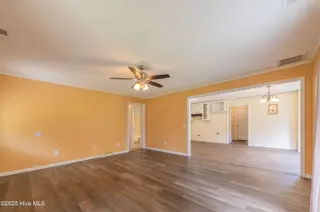 127 Rodney Lanier Road, Chinquapin, NC 28521 — 3-bedroom home, Chinquapin, NC, photo 13 of 61: Living room and dining area