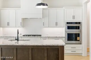 1943 Redfish SW, Supply, NC 28462 — 4-bedroom home in Oyster Harbour, Supply, NC, photo 15 of 42: Kitchen Island