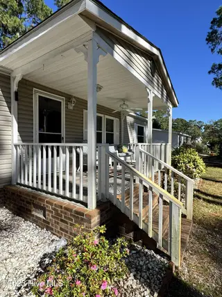 211 Beachwood Drive NW, Calabash, NC 28467 — 3-bedroom manufactured home in Ocean Forest, Calabash, NC, photo 10 of 75: porch 1