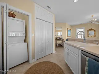 119 Salter Path Road 202a, Pine Knoll Shores, NC 28512 – photo 23: Laundry Closet in Kitchen