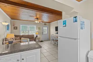 103 24th Street, Emerald Isle, NC 28594 — 4-bedroom townhome in Emerald Isle By The Sea, Emerald Isle, NC, photo 23 of 51: Kitchen & Living Area