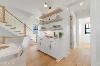 216 Radio Island Road, Morehead City, NC 28557 — 4-bedroom home in Tide Lines, Morehead City, NC, photo 17 of 56: Custom Wet Bar & Built-Ins