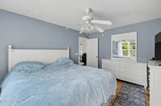 121 NE 6th Street, Oak Island, NC 28465 – photo 11: 22_121_NE_6th_St-Bedroom-GE82