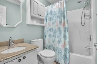 135 NE 36th Street, Oak Island, NC 28465 – photo 20: 14-Final 135 NE 36th St OKI-RJREM-7034