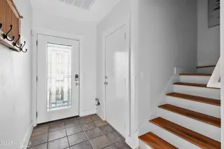 1106 Fort Fisher Boulevard N Unit 1, Kure Beach, NC 28449 – photo 11: 9 - Main Entrance, Garage & Stairwell