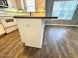 2928 Mulberry Lane A, Greenville, NC 27858 – photo 13: Kitchen Granite Bar Overhang for Bar Sto