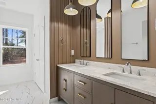 355 S Middleton Drive NW, Calabash, NC 28467 – photo 24: Accent Wall with Dual Sink Vanity