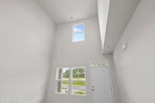 806 Palm Frond Way NW, Calabash, NC 28467 – photo 12: vaulted ceiling view from kitchen