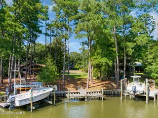 117 White Ash Drive, Pine Knoll Shores, NC 28512 – photo 3: Dock at end of canal