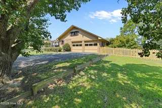 303 N Lincoln Street, Benson, NC 27504 – photo 9: Right side exterior - attached garage