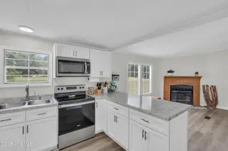 2216 Bell Williams Road, Burgaw, NC 28425 — 3-bedroom manufactured home, Burgaw, NC, photo 6 of 25: Kitchen – Bright and Functional
