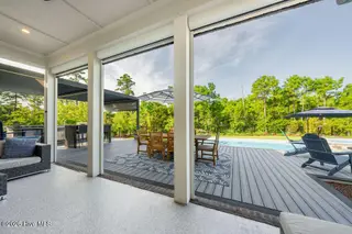 3211 Oceanic Bay Drive, Southport, NC 28461 — 4-bedroom home in St James, Southport, NC, photo 16 of 38: Screened Porch