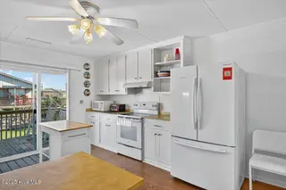 4328 E Dolphin Drive, Oak Island, NC 28465 – photo 13: 13-kahunaphoto - Copy