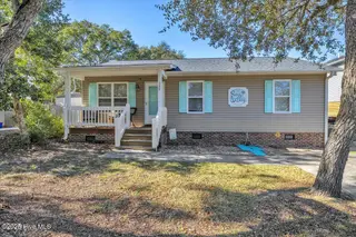 135 NE 36th Street, Oak Island, NC 28465 – photo 1: 01-Final 135 NE 36th St OKI-RJREM-7128