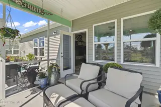 9410 Barnstormer Drive NW, Calabash, NC 28467 — 3-bedroom home in Eagle Run, Calabash, NC, photo 21 of 47: Screened-in Porch