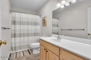 6707 Kings Lynn Drive, Oak Island, NC 28465 – photo 17: down bath