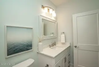 137 NE 3rd Street, Oak Island, NC 28465 – photo 20: 2nd Bathroom