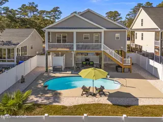 224 NE 58th Street, Oak Island, NC 28465 – photo 3: 6-web-or-mls-DJI_20251031141532_0321_D