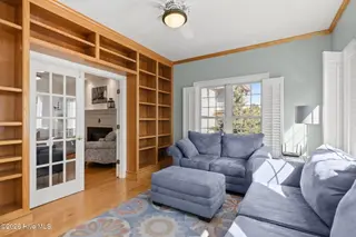 312 Lord Berkeley Drive, Emerald Isle, NC 28594 – photo 17: Sun Room with Built in Book Shelves