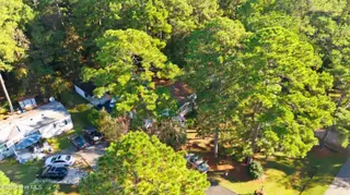 243 Ocean Forest Drive NW, Calabash, NC 28467 — 3-bedroom manufactured home in Ocean Forest, Calabash, NC, photo 22 of 61: DJI_20251101095917_0008_D