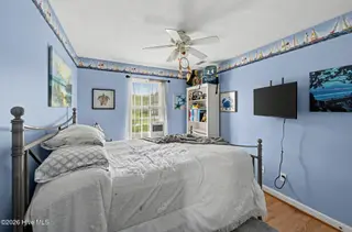 121 NE 6th Street, Oak Island, NC 28465 – photo 14: 27_121_NE_6th_St-Bedroom-GE58