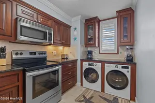 1505 Salter Path Road 228, Indian Beach, NC 28512 – photo 6: Kitchen/Laundry Area