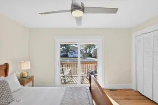 501 Shoreline Drive E, Sunset Beach, NC 28468 – photo 15: Sliding door to front porch