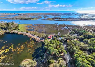 641 Shoreline Drive W, Sunset Beach, NC 28468 – photo 2: DJI_20250107143140_0007_D