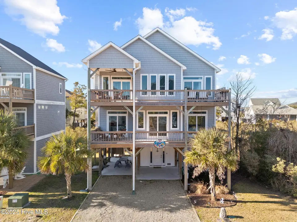 317 Oceanaire Lane, Surf City, NC 28445 – photo 1 of 61: DJI_20250114101130_0416_D