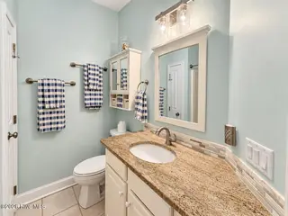 301 Wisteria Way, Caswell Beach, NC 28465 – photo 23: Hall bath