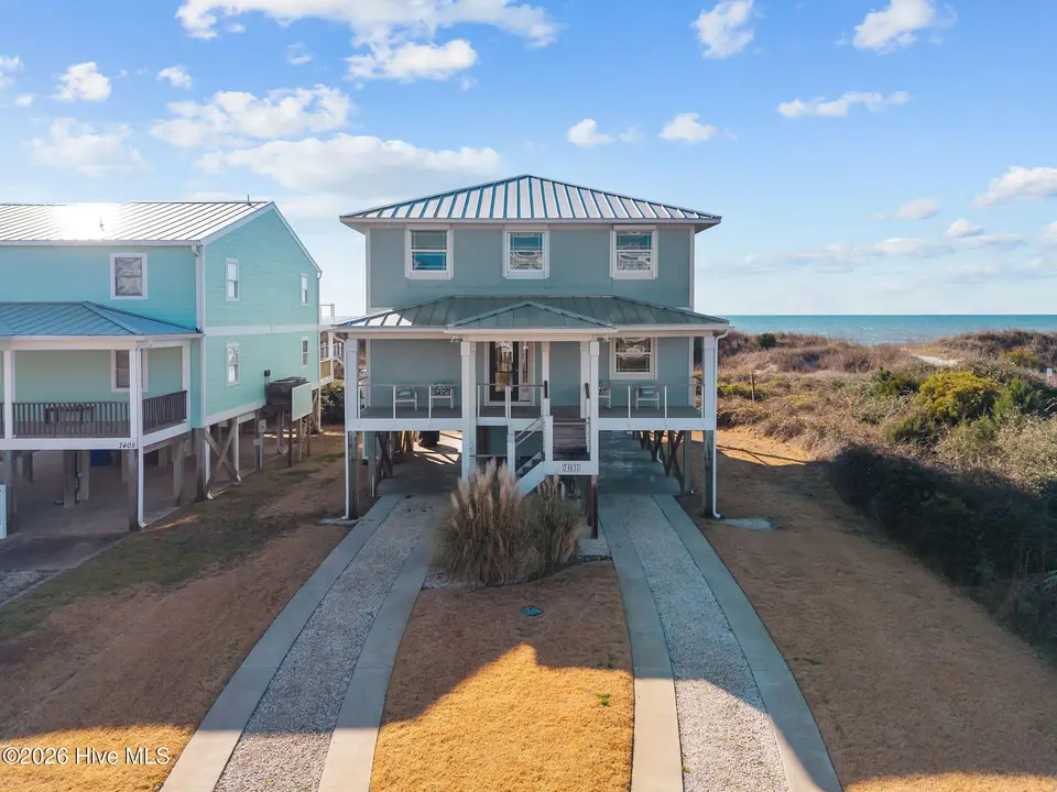 7403 E Beach Drive, Oak Island, NC 28465 – photo 1 of 54: Oceanfront Coastal Curb Appeal