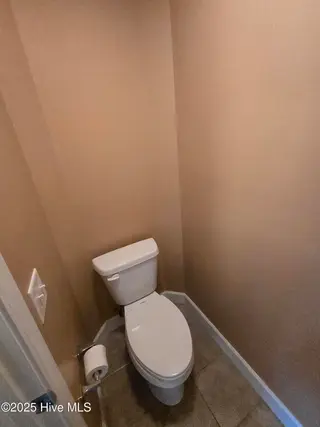 833 Fifty Lakes Drive, Southport, NC 28461 – photo 16: Primary water closet