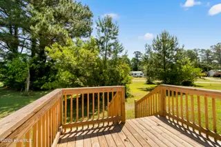 490 Orchard Lane SE, Bolivia, NC 28422 — 3-bedroom manufactured home in Vineyard Plantation, Bolivia, NC, photo 5 of 27: Back deck