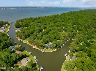 117 White Ash Drive, Pine Knoll Shores, NC 28512 – photo 9: Enjoy the privacy of the canal