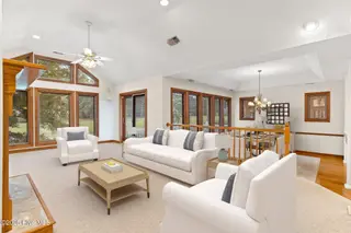 255 Genoes Point Road SW, Supply, NC 28462 – photo 5: 255 Genoes Pt living room virtually stag