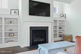 3244 Oceanic Bay Drive, Southport, NC 28461 – photo 12: 55" TV | Windows over Bookcases