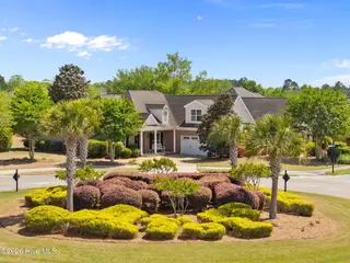 8256 Ibis Point NE, Leland, NC 28451 — 4-bedroom home in Compass Pointe, Leland, NC, photo 2 of 75: 13-web-or-mls-DJI_20260417143736_0981_D