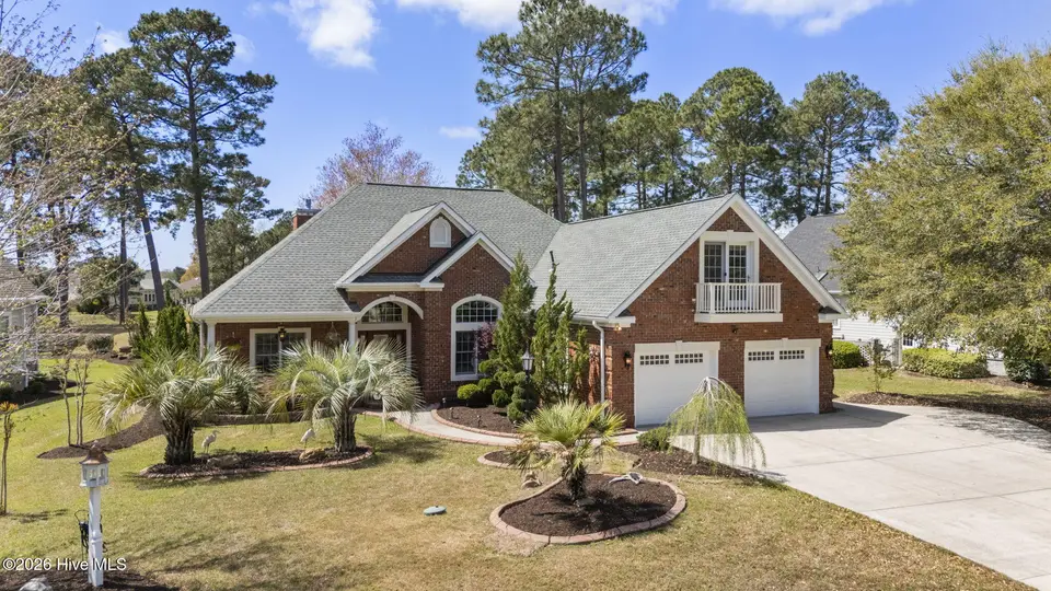 555 Stanton Hall Drive NW, Calabash, NC 28467 – photo 1 of 59: 1-web-or-mls-DJI_20260330131809_0023_D