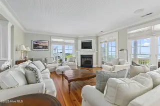 125 Roosevelt Drive, Pine Knoll Shores, NC 28512 — 5-bedroom home in Roosevelt Beach, Pine Knoll Shores, NC, photo 3 of 61: Light-filled LR w/ fireplace