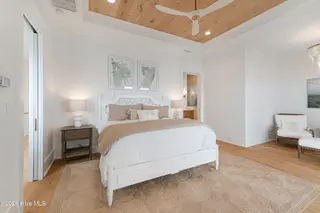 216 Radio Island Road, Morehead City, NC 28557 — 4-bedroom home in Tide Lines, Morehead City, NC, photo 22 of 56: Primary Bedroom w/ Wood Ceiling