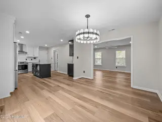 250 Star Hill Drive, Cape Carteret, NC 28584 – photo 16: Dining room to kitchen and living room