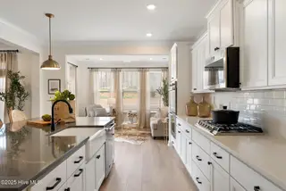3355 Grand Park Way, Leland, NC 28451 – photo 10: Kitchen to Sunroom - Yates II B - Foxhal