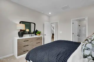 1218 Sunwater Terrace, Leland, NC 28451 — 4-bedroom townhome in Grand Park, Leland, NC, photo 16 of 49: Second Primary Bedroom - Hyacinth BE - G