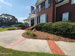 25 Muirfield Drive, Whiteville, NC 28472 – photo 7: Welcoming walkway to front door