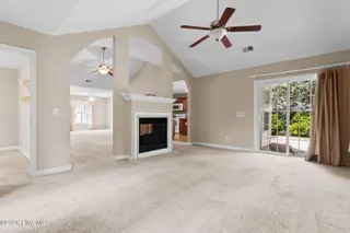 76 Calabash Drive, Calabash, NC 28467 – photo 8: Carolina Room Fireplace kitchen
