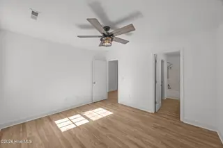 3414 Richard Court, New Bern, NC 28560 — 3-bedroom home in Pinecrest Estates, New Bern, NC, photo 11 of 38: another view of primary and bathroom
