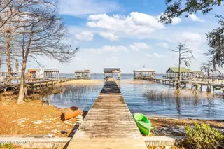 2517 Waccamaw Shores Road, Lake Waccamaw, NC 28450 – photo 7: water view towards boathouse
