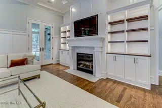 3508 Concordia Avenue SW, Supply, NC 28462 – photo 10: Family Room Fireplace and Built Ins